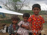 Rajasthani migrants in Narsapur village near temple